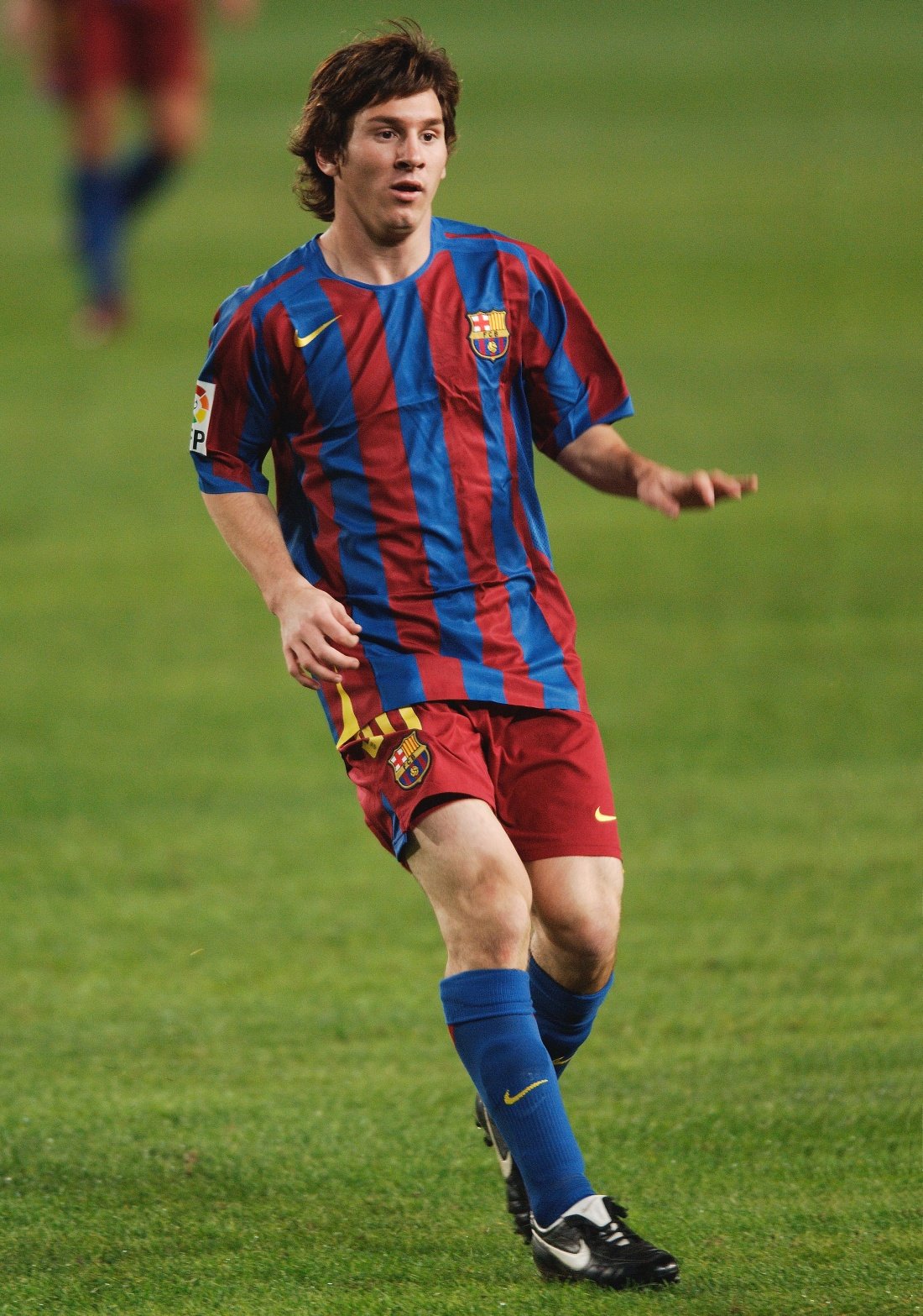 Young Lionel Messi in action for FC Barcelona against Málaga in October 2005